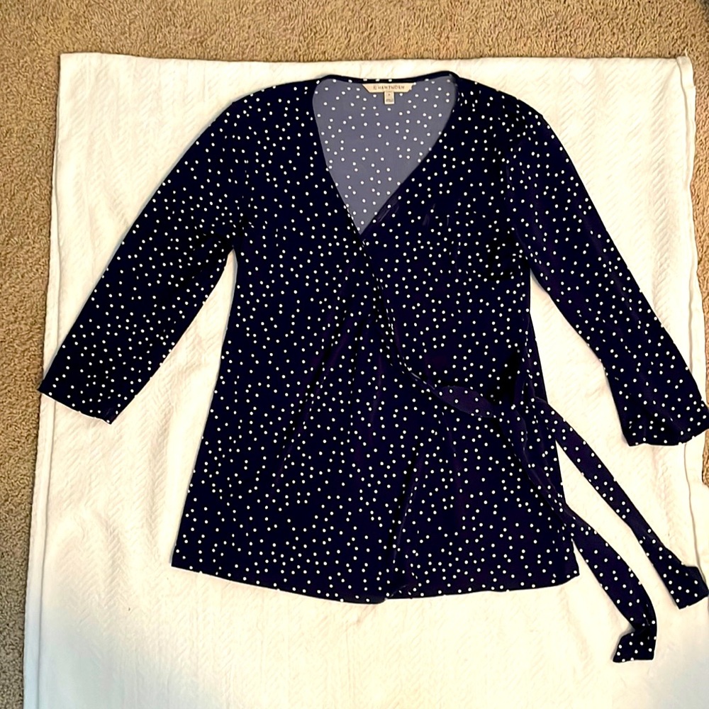 Blue polka dot long sleeve poly mix. Ties off to side Hook top for closure.